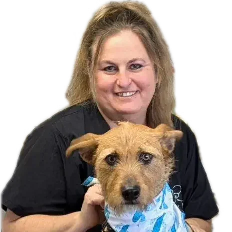 The owner, Sally Parker with a dog wearing a blue bandana